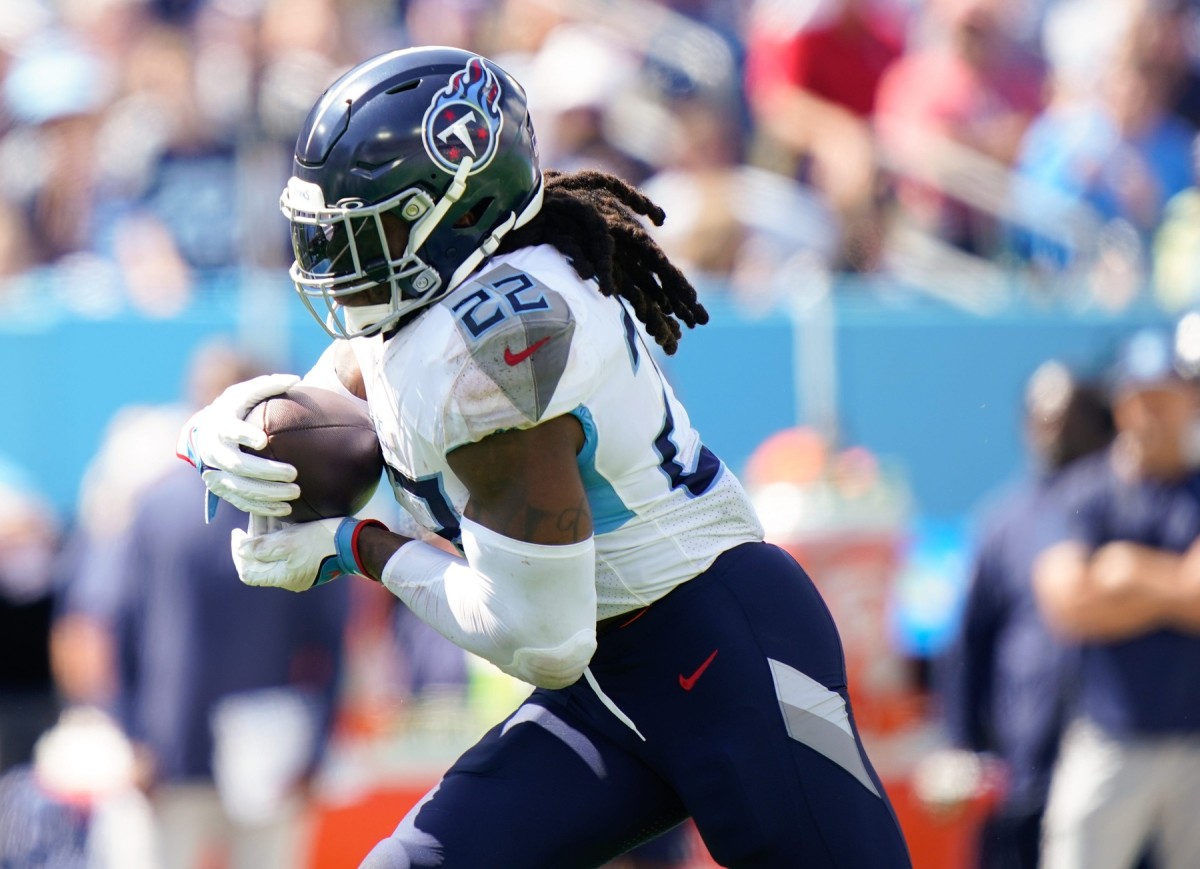 Titans running back Derrick Henry (22) runs the ball in the third quarter against the Los Angeles Chargers at Nissan Stadium.